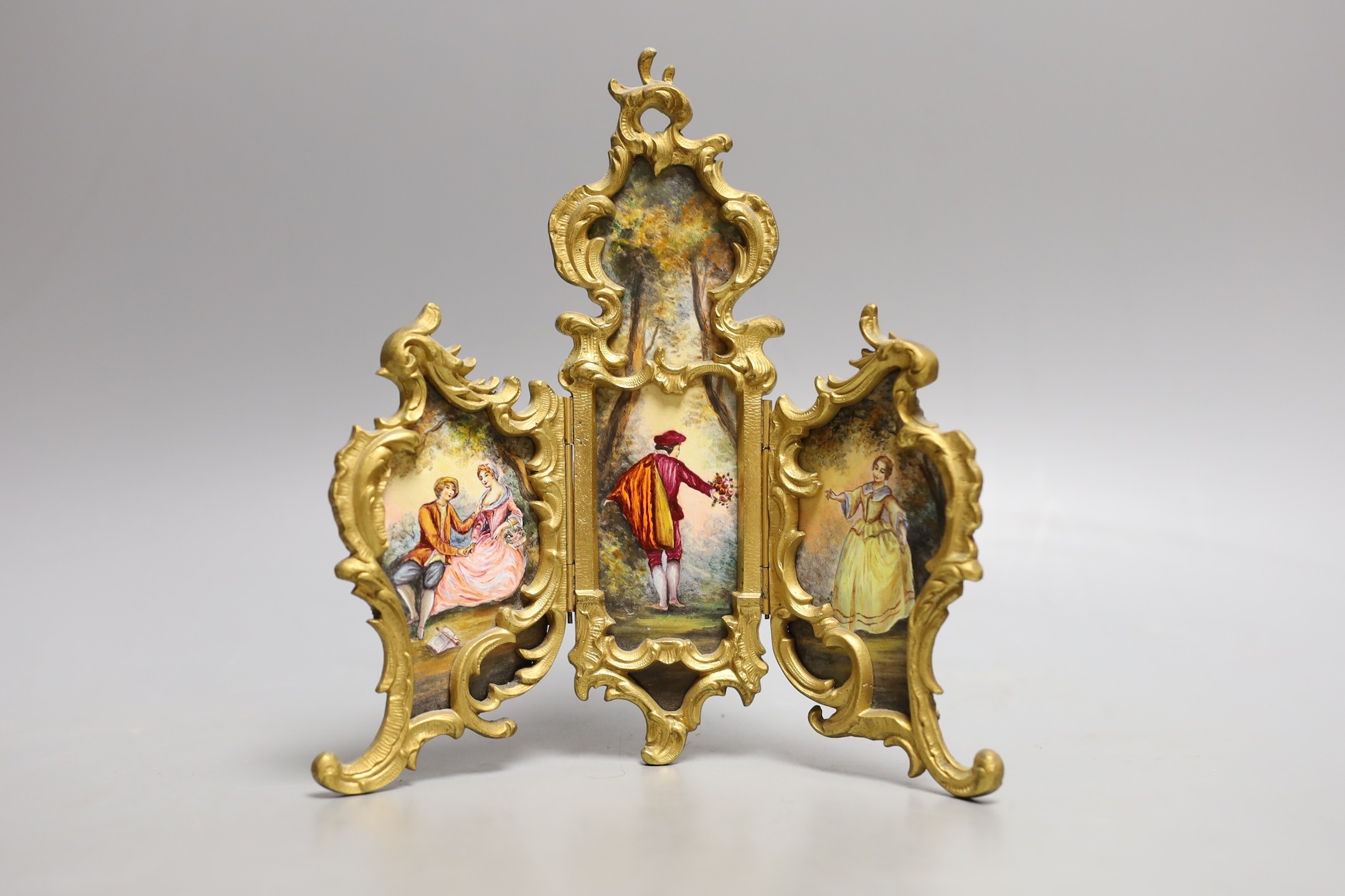 A suite of Viennese enamelled miniature furniture: 3 fold screen, table, salon sofa, a pair of armchairs and 2 dining chairs